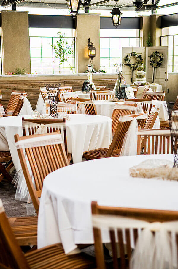 Purple orchid Halfpint Design - Places like Noah's Event Venue provide beautifully designed spaces that include tables, chairs, and linens. They will also help connect you with any other event vendors you might need.